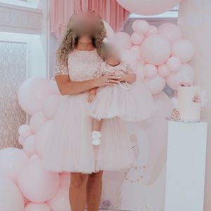 Costume made mommy and daughter matching dresses.